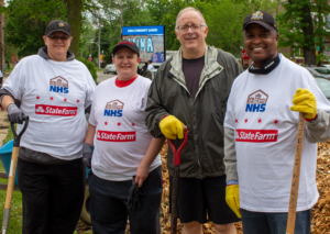 State Farm and NHS communities come together to clean garden. 